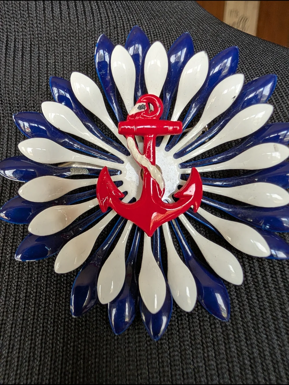 Nautical Red Anchor Brooch with Blue and White Petal Design